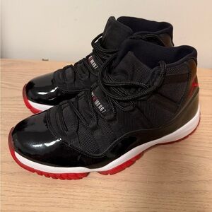 Jordan 11 Retro Playoffs (2012) Bred Black/Varsity 
Men size 10.5